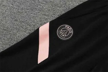 PSG-poloshirt met zwarte en roze mouwen