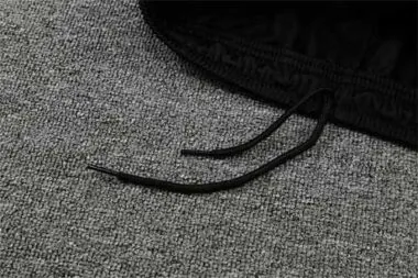 PSG-poloshirt met zwarte en roze mouwen